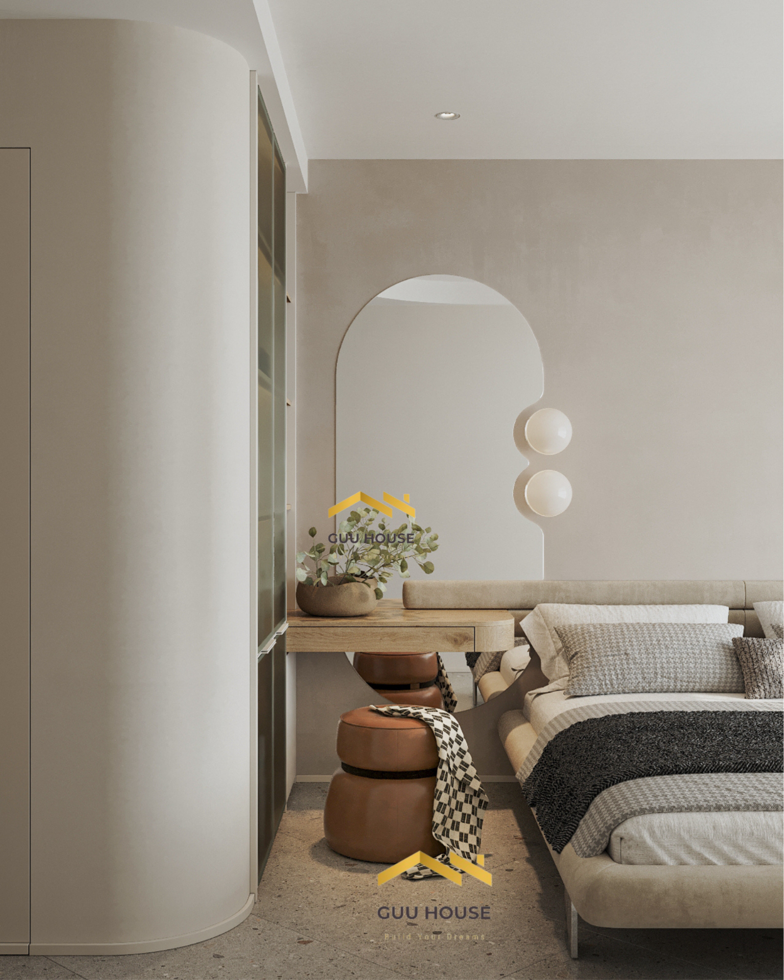 Góc bàn trang điểm phòng ngủ hiện đại với gương vòm mềm, bàn gỗ và ghế đôn da màu nâu