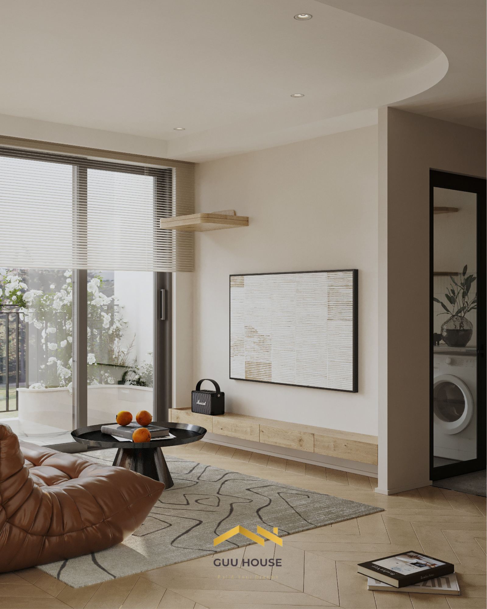 Phòng khách căn hộ hiện đại gần ban công với sofa da nâu, bàn trà đen, thảm sáng màu và ánh sáng tự nhiên